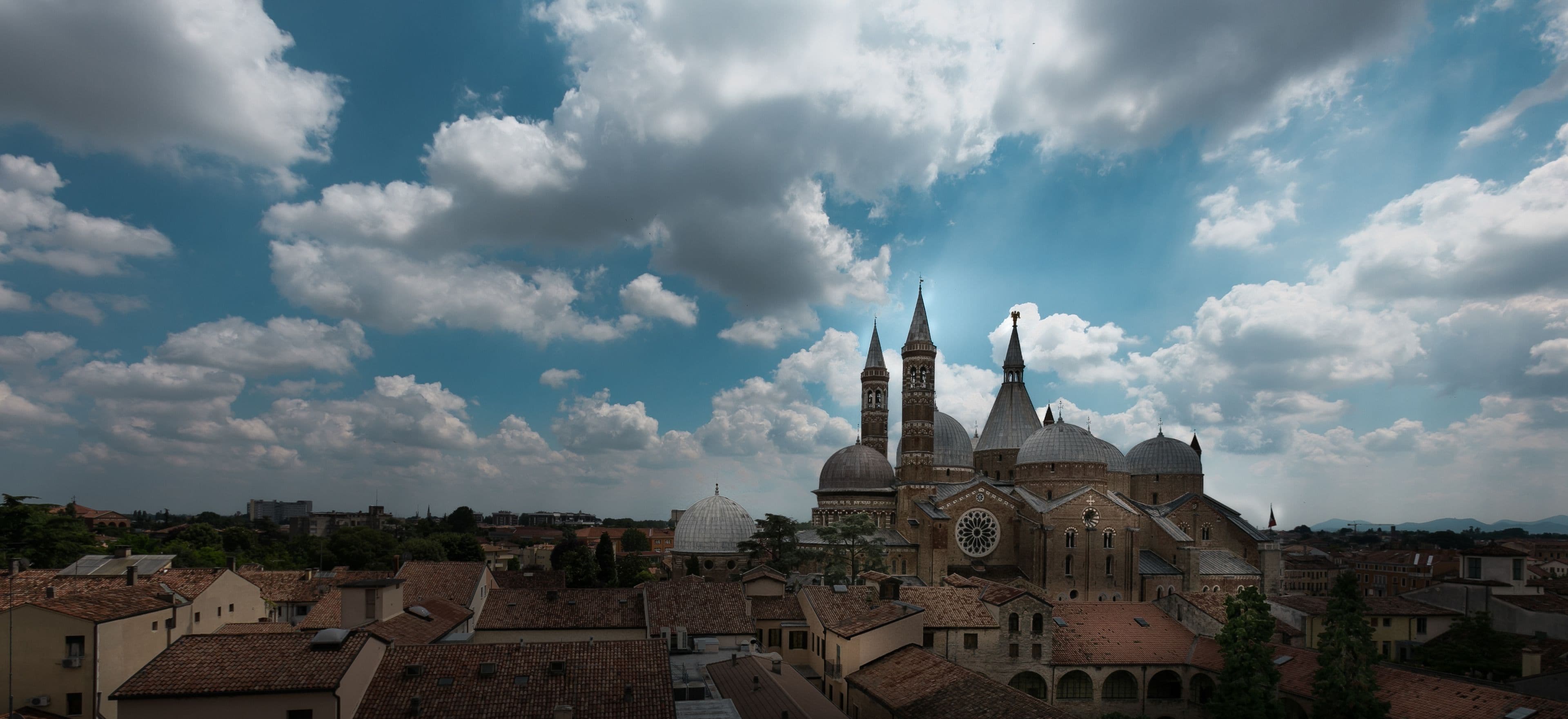 A historic church with multiple domes and spires, surrounded by traditional buildings.