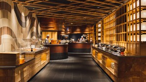 A modern kitchen with wooden accents and a central island. - Tsuetate Onsen Hizenya (Oguni)