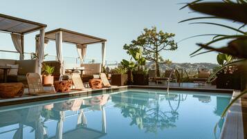 Outdoor pool, open 7:00 AM to 5:00 PM, pool umbrellas, pool loungers