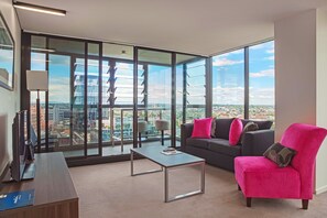 Three Bedroom Executive Apartment | Living area | 32-inch LCD TV with cable channels, TV