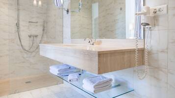 Designer toiletries, hair dryer, bathrobes, towels