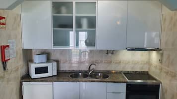 Fridge, microwave, stovetop, cookware/dishes/utensils