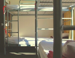 A bunk bed room with a metal ladder and a single bed. - 790 on George Backpackers (Haymarket)