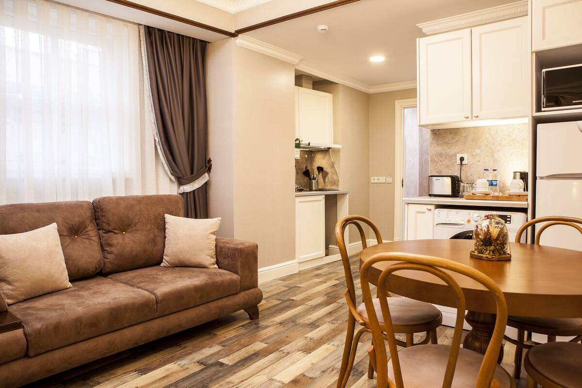 Deluxe Apartment, 2 Bedrooms | Living area | 56-inch LED TV with satellite channels, TV