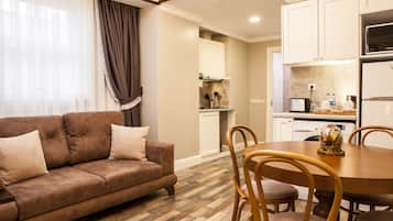 Deluxe Apartment, 2 Bedrooms | Living area | 56-inch LED TV with satellite channels, TV