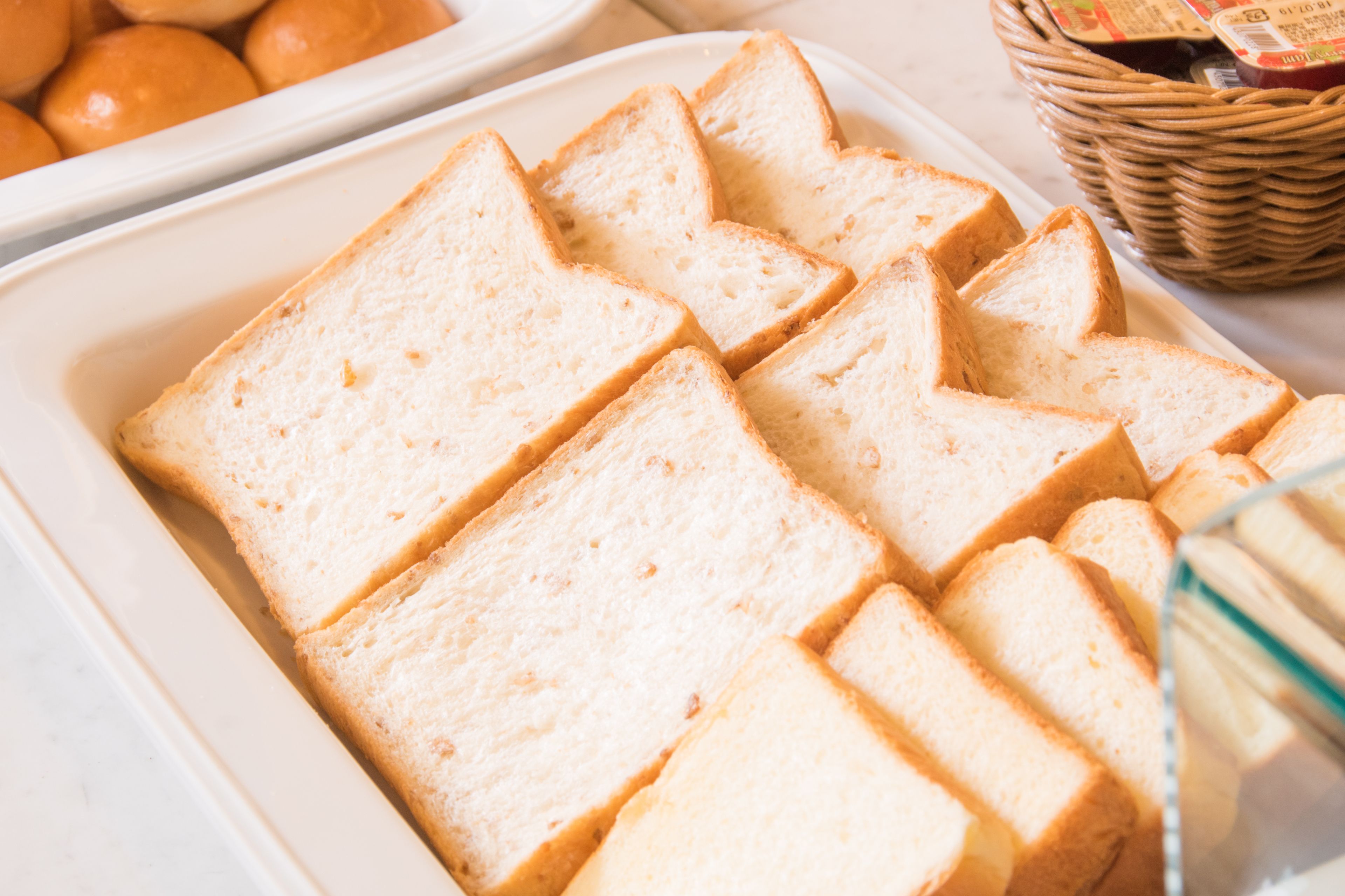 A tray of sliced white bread arranged in a pattern.