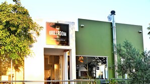 A restaurant named "The Grillroom" with a green exterior wall and a visible entrance. - Val Du Charron Wine & Leisure Estate (Wellington)