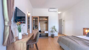 Deluxe Room, Sea View | Free minibar, in-room safe, desk, laptop workspace