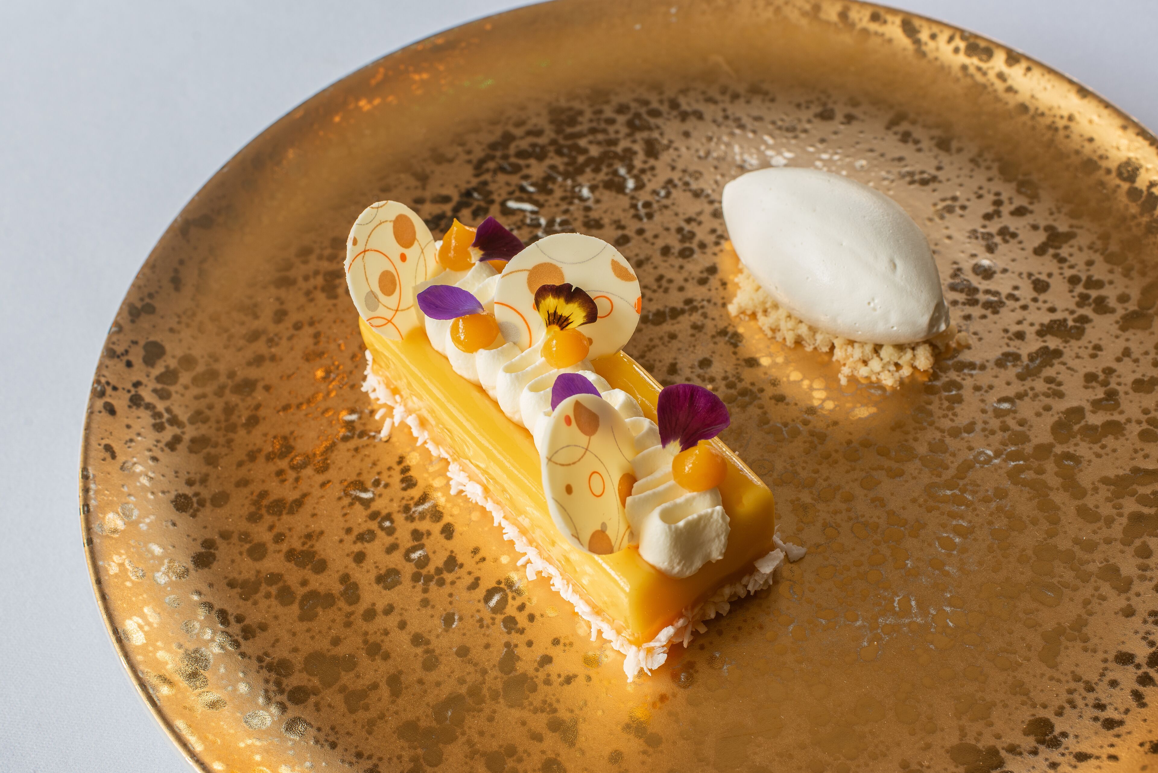 A dessert on a textured plate.