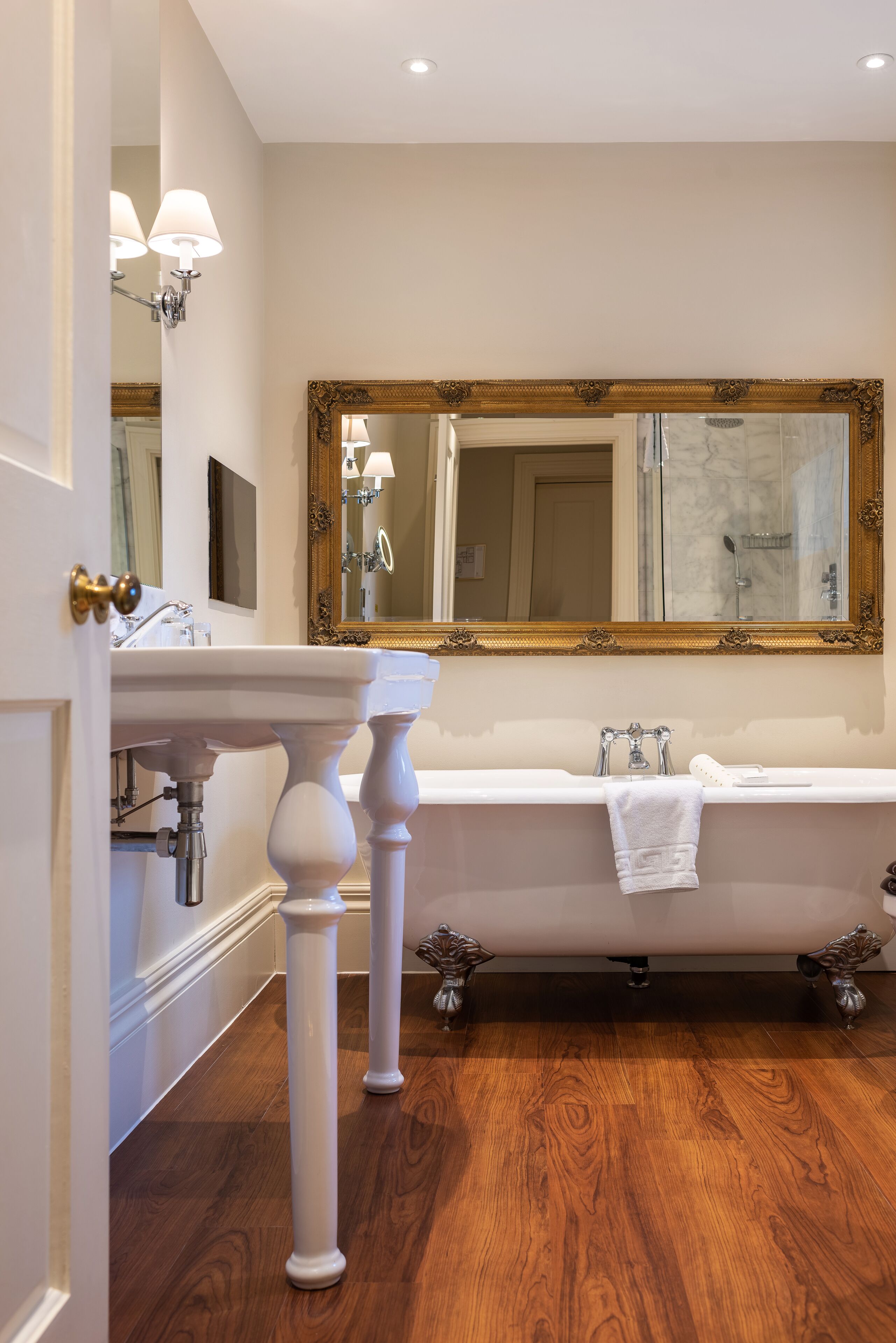 designer toiletries, hair dryer, bathrobes, slippers