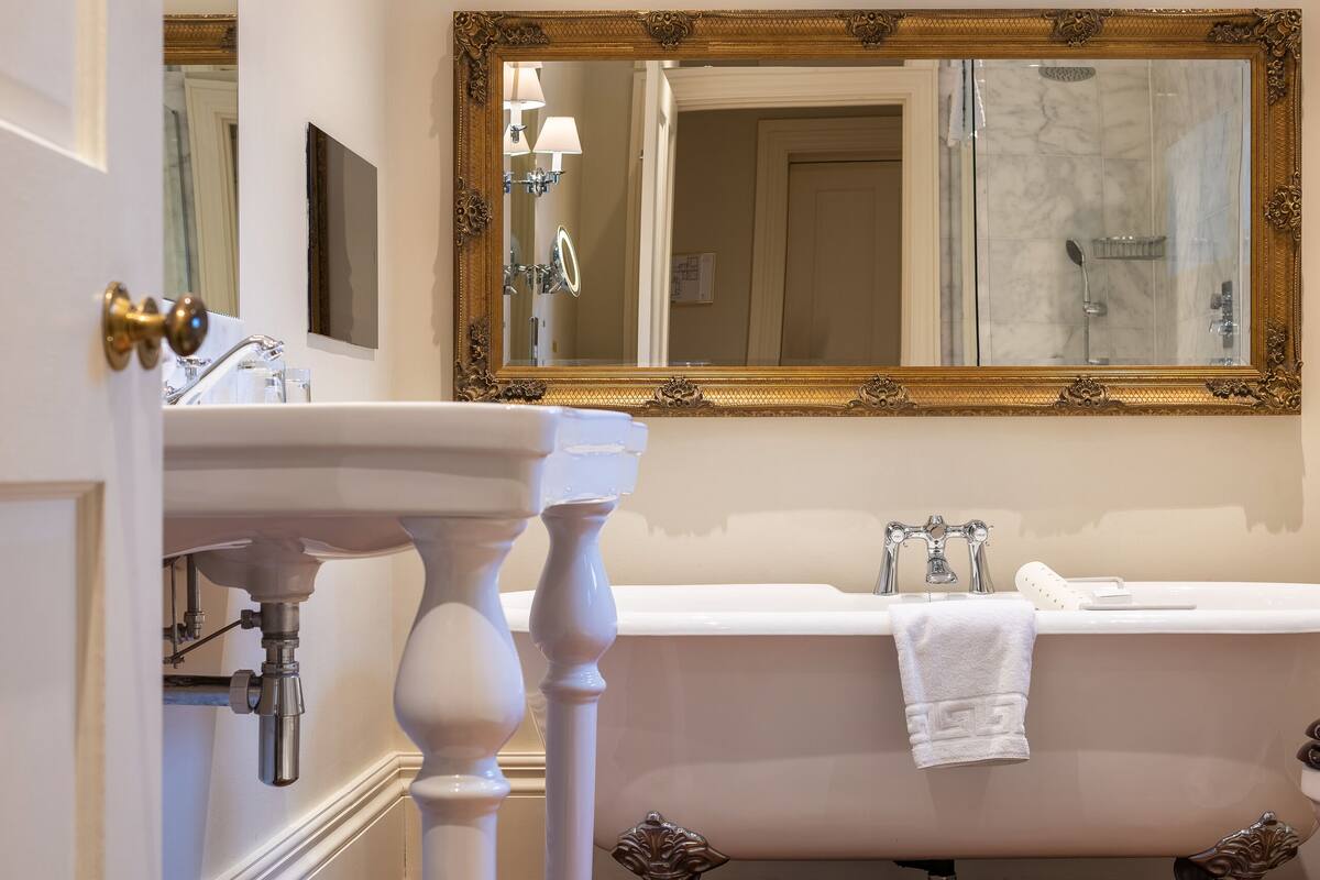 designer toiletries, hair dryer, bathrobes, slippers