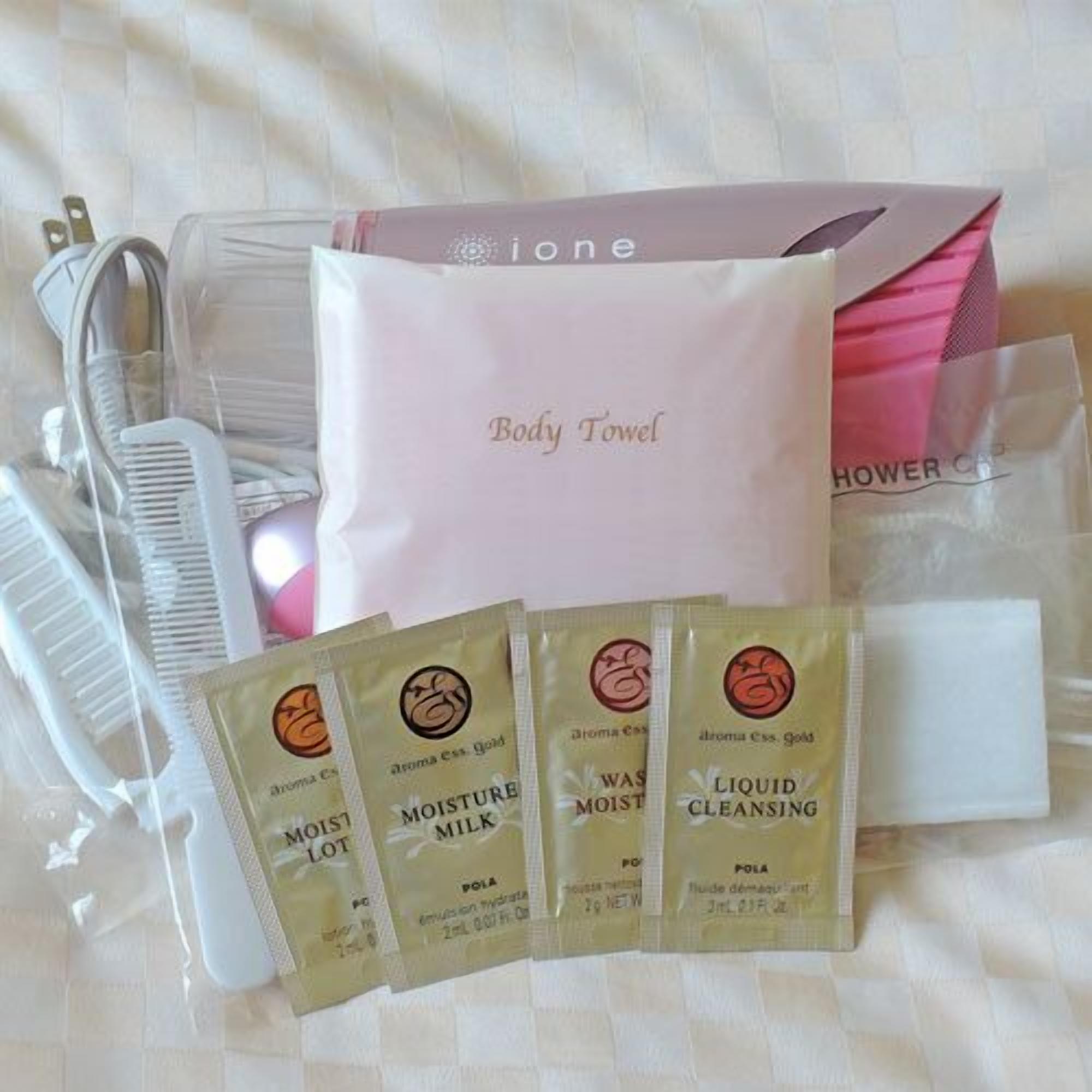 A collection of personal care items including a body towel, combs, and liquid cleansing products.