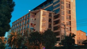 A multi-story hotel with a prominent sign for "Sorbonne Hotel" and "Hotel Wellness Center" on the top. - Soramba Hotel (Addis Ababa)