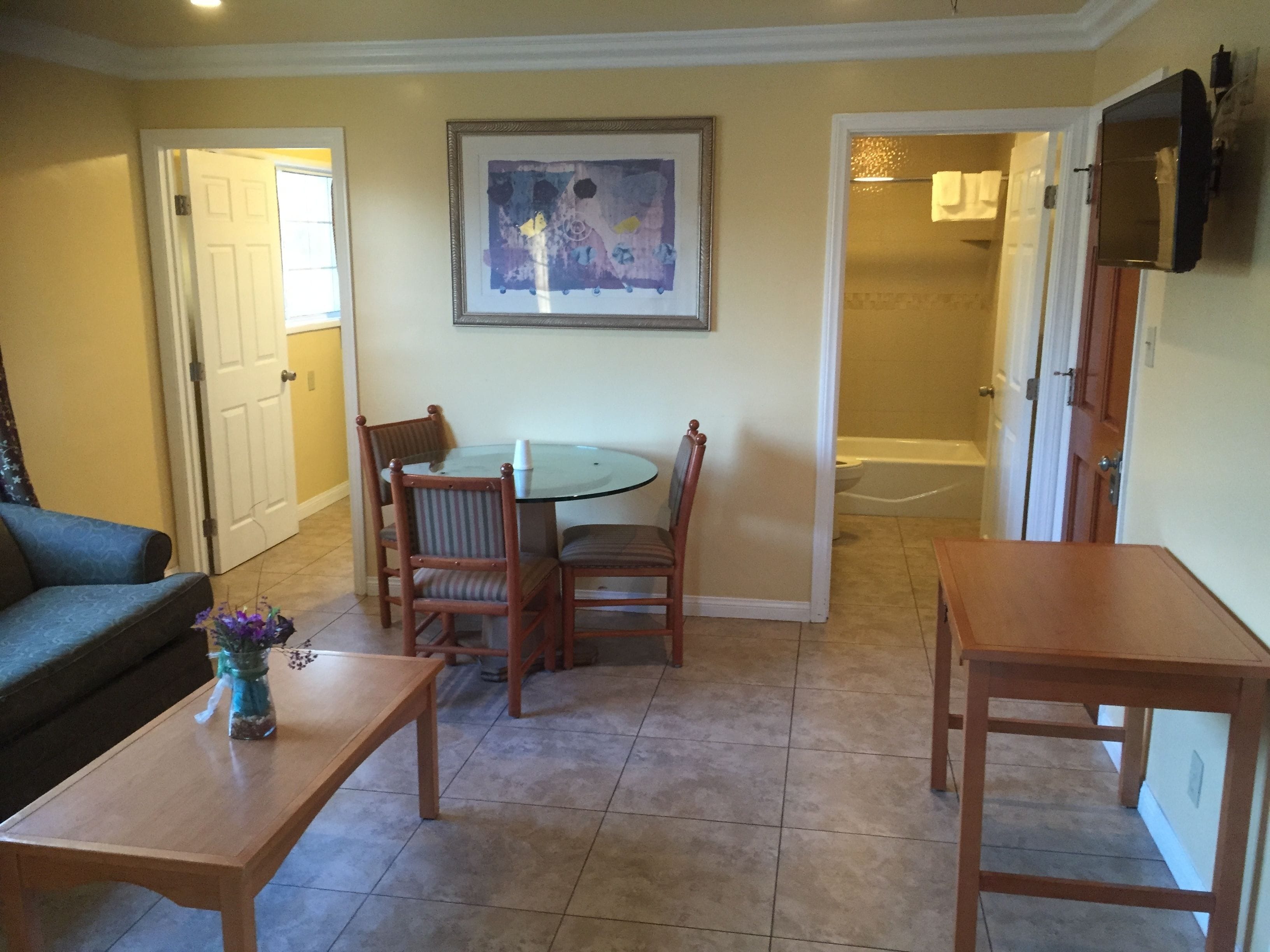 Executive Suite, Multiple Beds, Kitchenette | Living area | TV