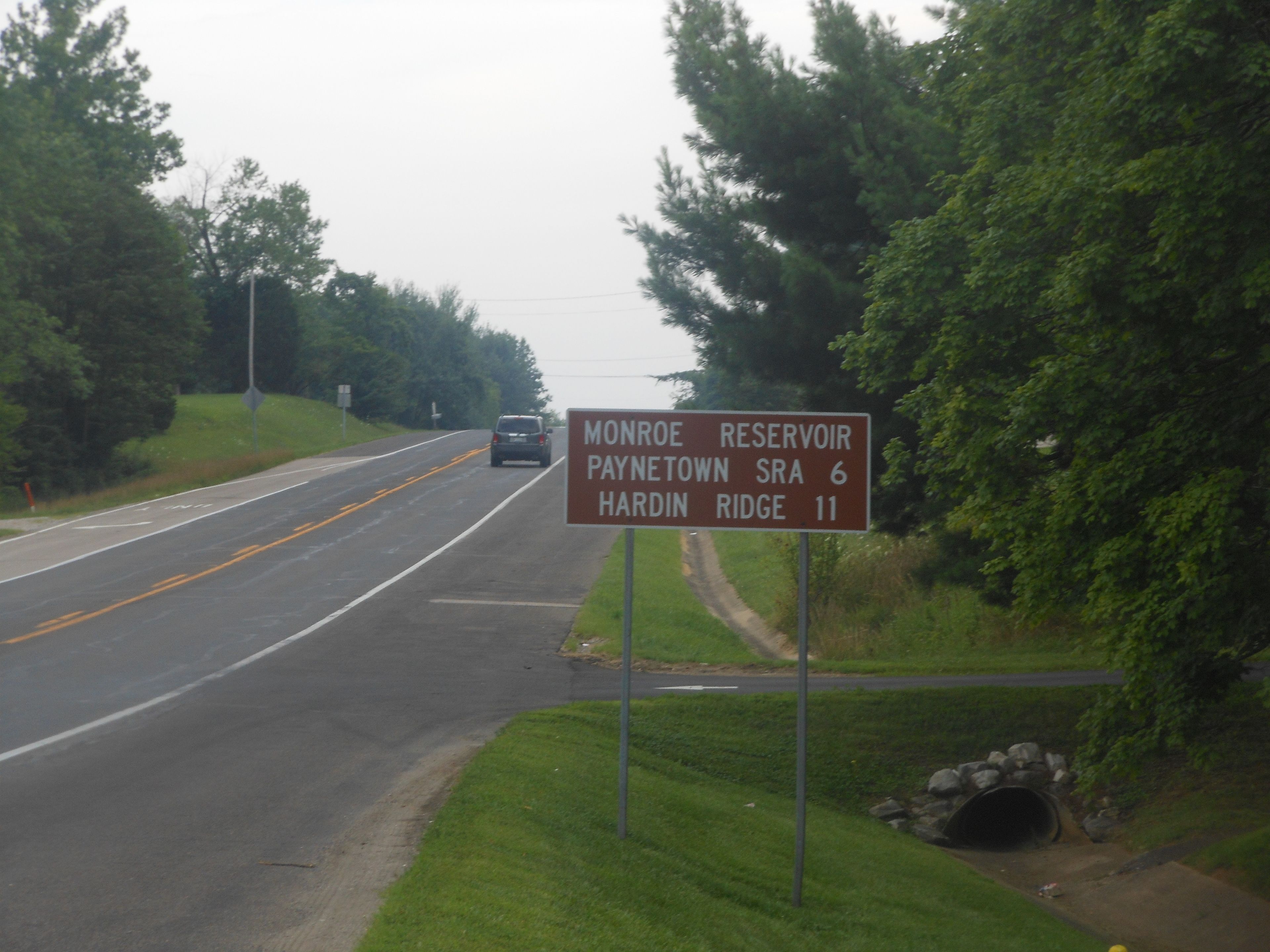 A road sign indicating directions to Monroe Reservoir, Paynetown SRA 6, and Hardin Ridge 11.