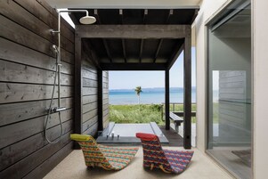 Ocean View Bath Suite | Down comforters, in-room safe, blackout drapes, iron/ironing board