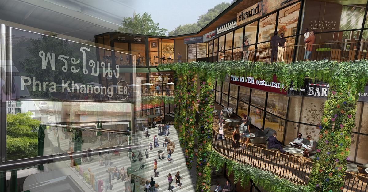 A modern shopping mall with a central atrium featuring a restaurant named "The River Restaurant" and a bar.