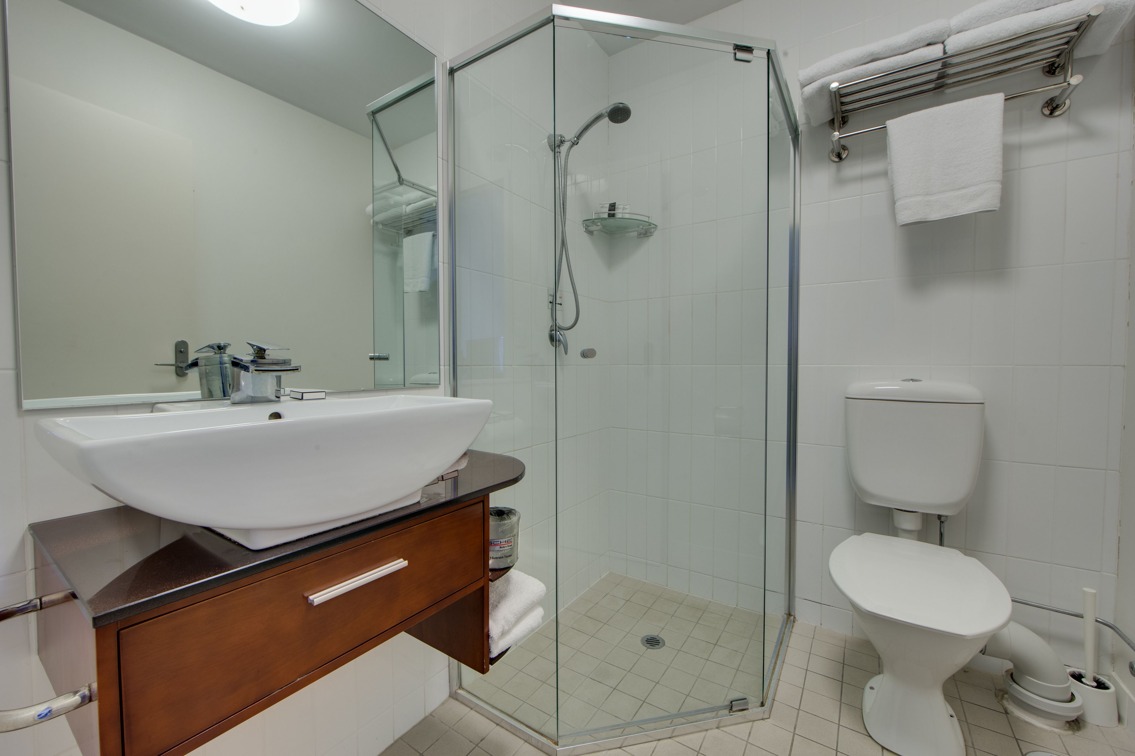 shower, designer toiletries, hair dryer, towels