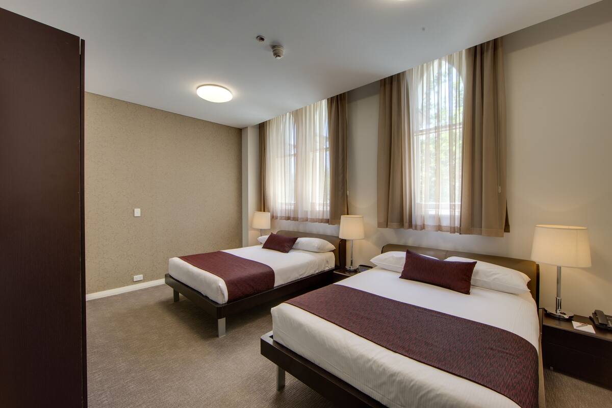 family room | 1 bedroom, in-room safe, desk, iron/ironing board