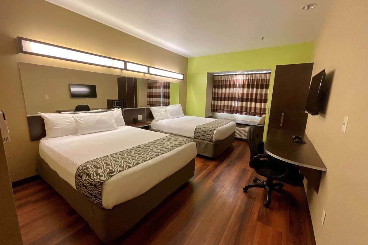 premium bedding, desk, laptop workspace, iron/ironing board