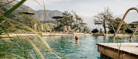 Seasonal outdoor pool, open 8:00 AM to 7:30 PM, pool umbrellas