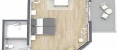 A floor plan of a hotel room with a bed, a seating area, a small table, and a window.