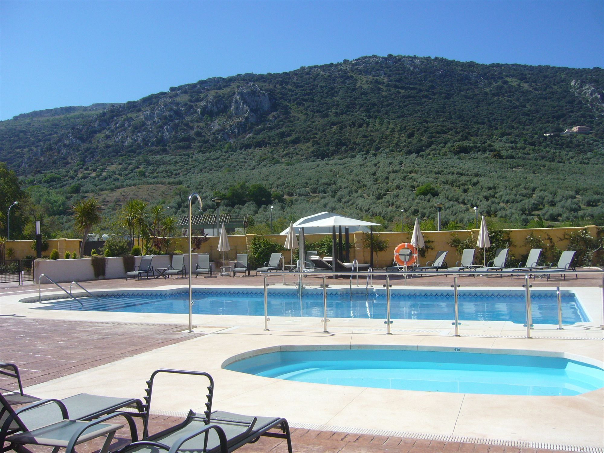 2 outdoor pools, pool umbrellas, pool loungers