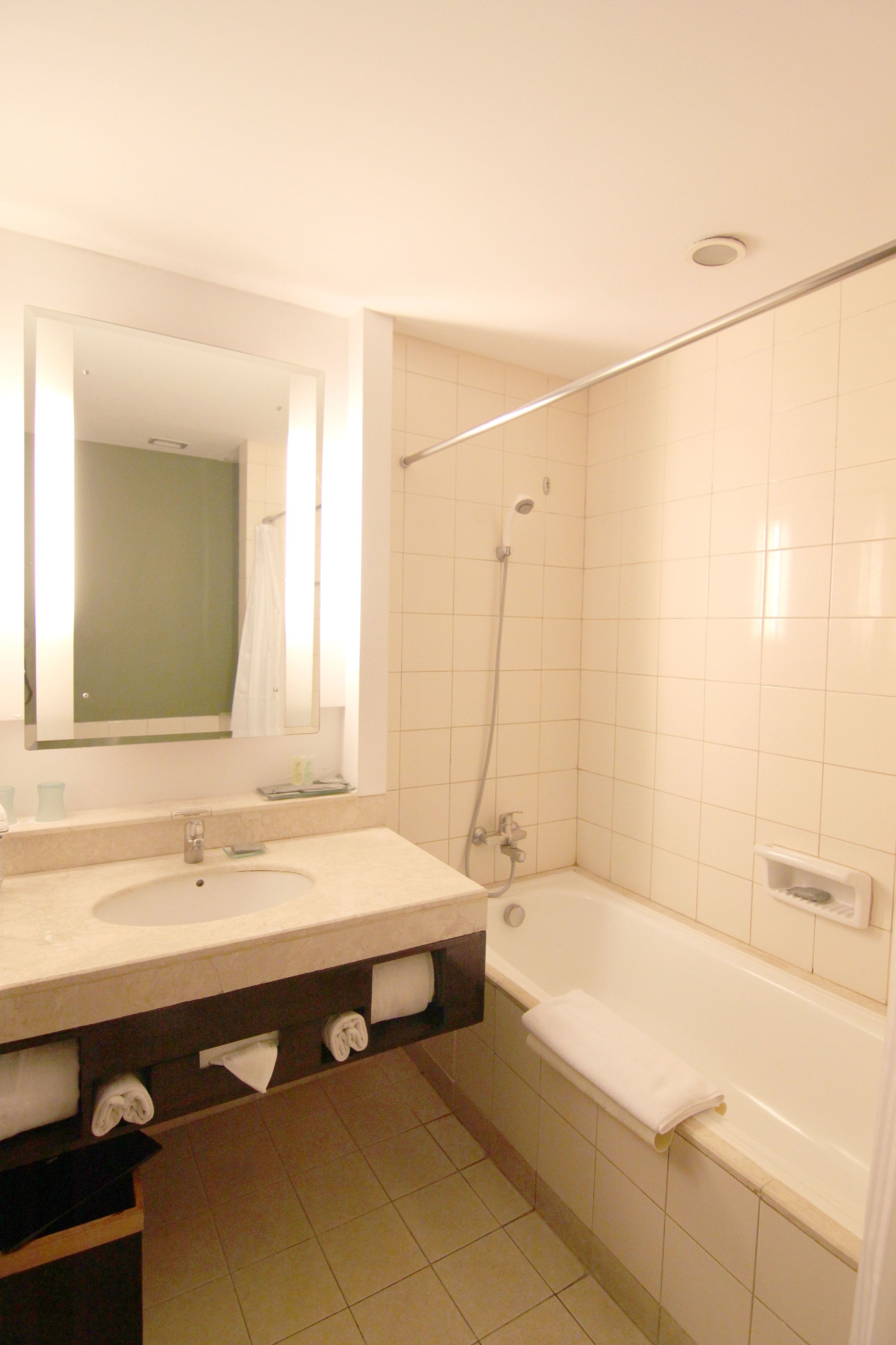 family room, 1 king bed (premier) | bathroom | free toiletries, hair dryer, towels
