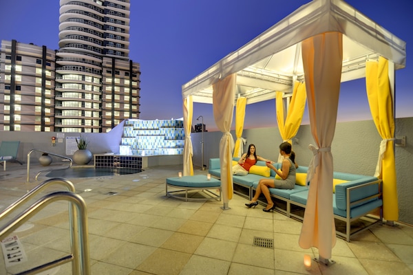 Outdoor pool, open 6:00 AM to 11:00 PM, free cabanas, sun loungers