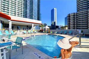 Outdoor pool, open 6:00 AM to 11:00 PM, free pool cabanas, pool loungers