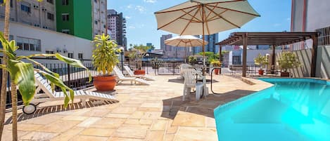 Outdoor pool, open 6:00 AM to 10:00 PM, pool umbrellas, sun loungers
