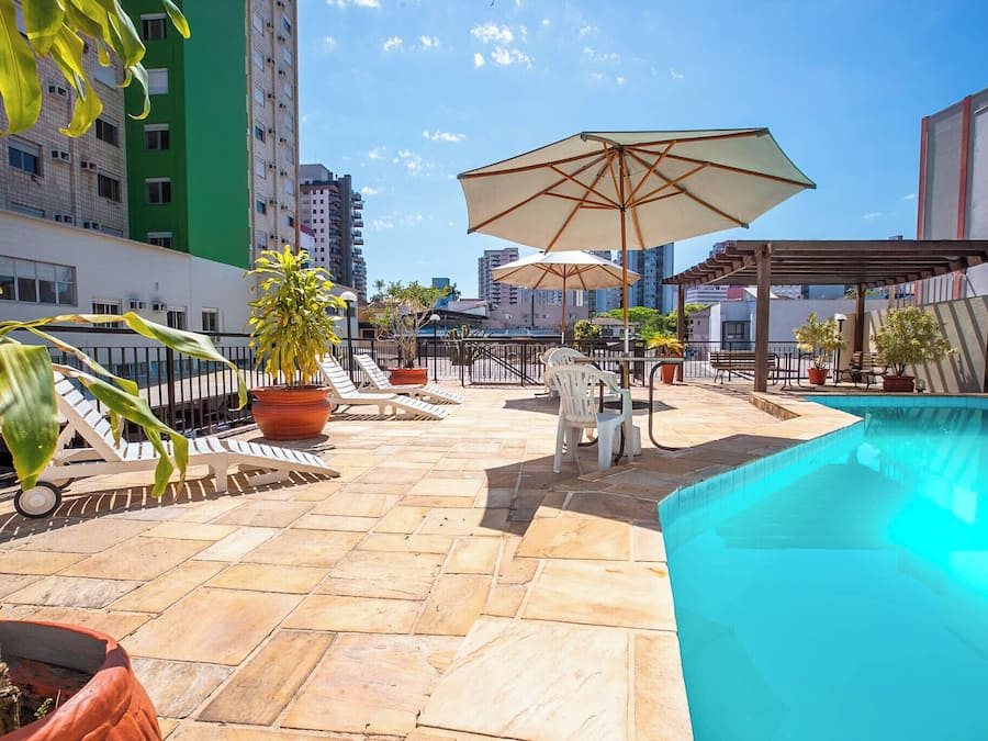 Outdoor pool, open 6:00 AM to 10:00 PM, pool umbrellas, sun loungers