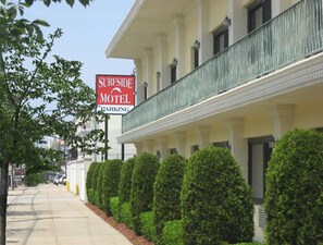 Accommodations available at this classic motel feature a balcony with a railing.