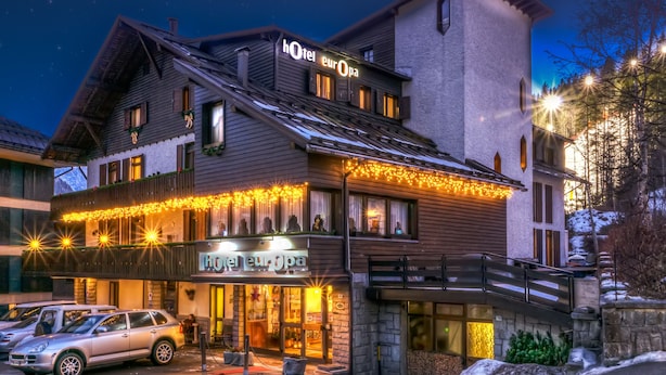 A hotel with a sign reading "Hotel Europa" and a stone facade. - Europa (Pinzolo)
