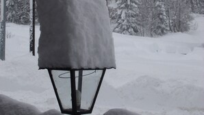 A snow-covered street lamp in a snowy landscape. - Europa (Pinzolo)