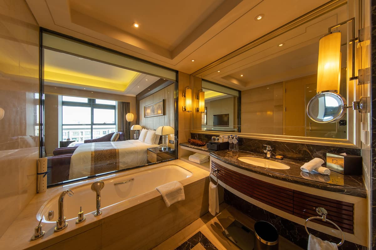 separate bathtub and shower, deep-soaking bathtub, designer toiletries