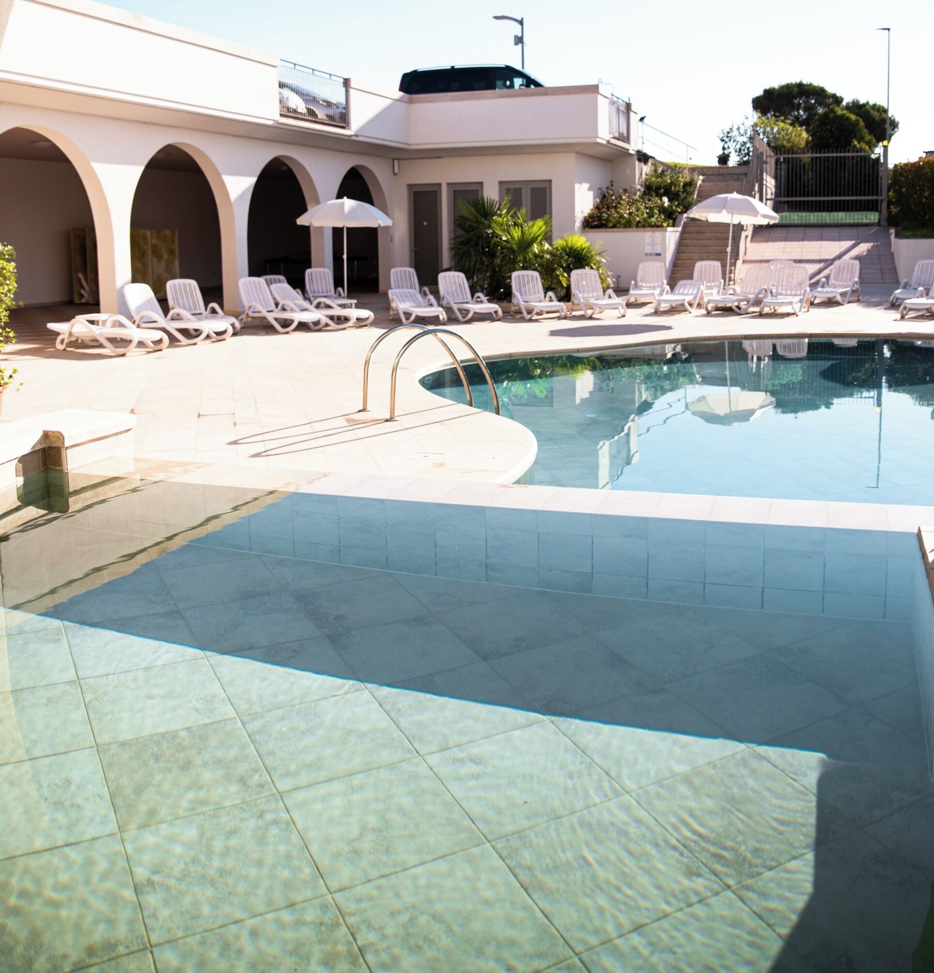 Seasonal outdoor pool, pool loungers
