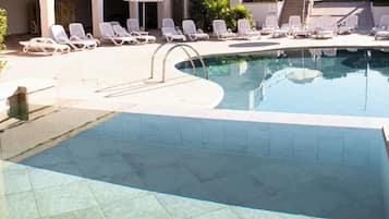 Seasonal outdoor pool, pool loungers