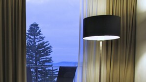 A room with a view of a tree and a mountain through a window. - Bay 10 Accommodation (Port Lincoln)