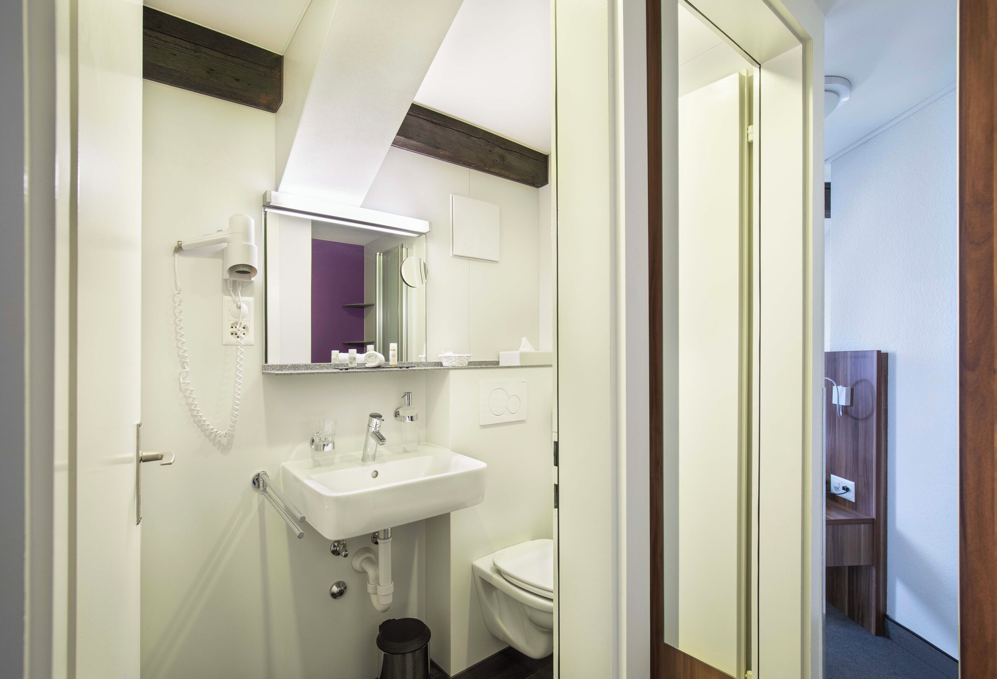 single attic | bathroom | shower, hair dryer, towels