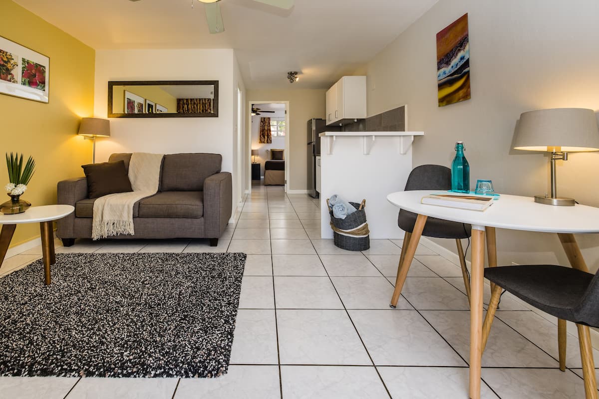 Suite, 1 Bedroom | Living area | 32-inch LCD TV with cable channels, TV, DVD player
