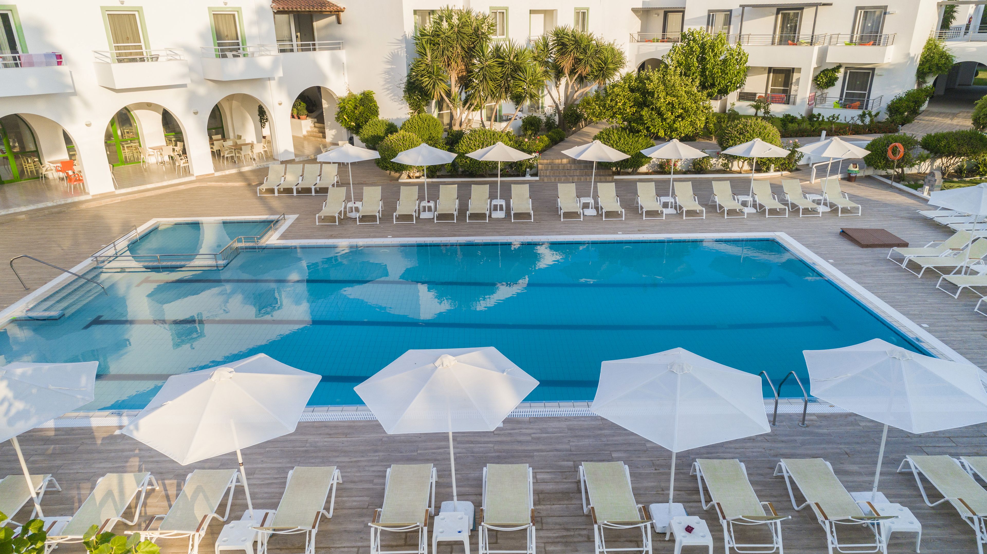 seasonal outdoor pool, pool umbrellas, pool loungers