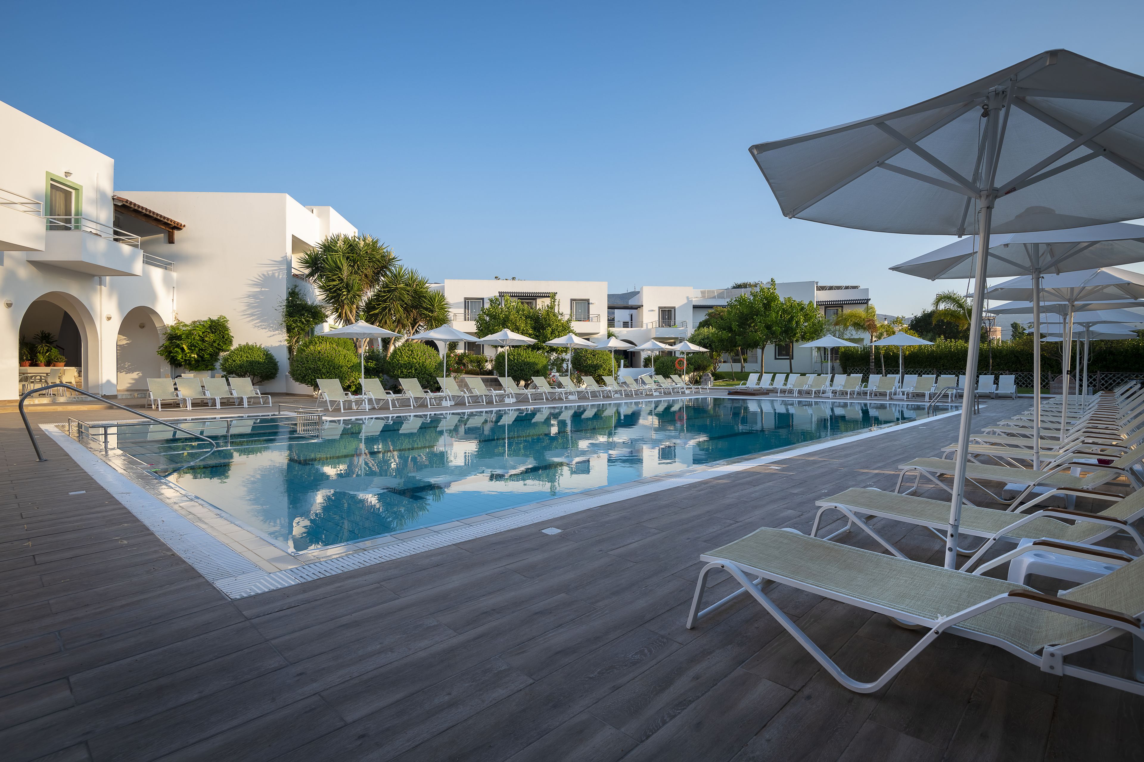 seasonal outdoor pool, pool umbrellas, pool loungers