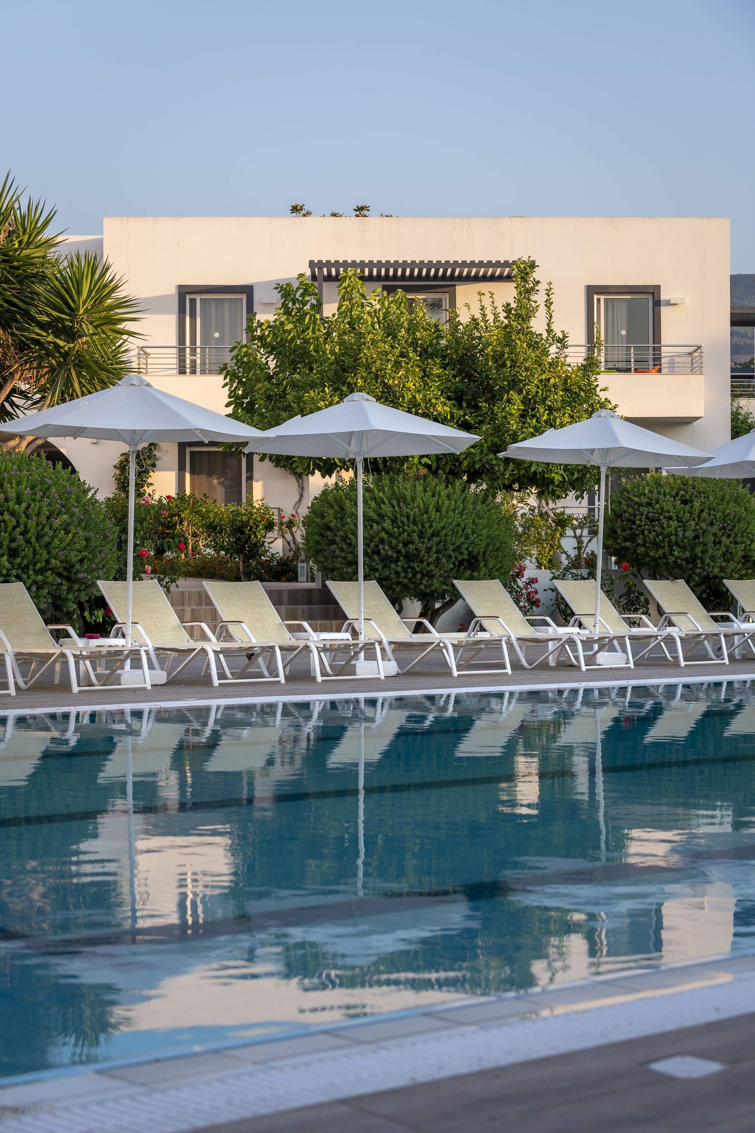 seasonal outdoor pool, pool umbrellas, pool loungers