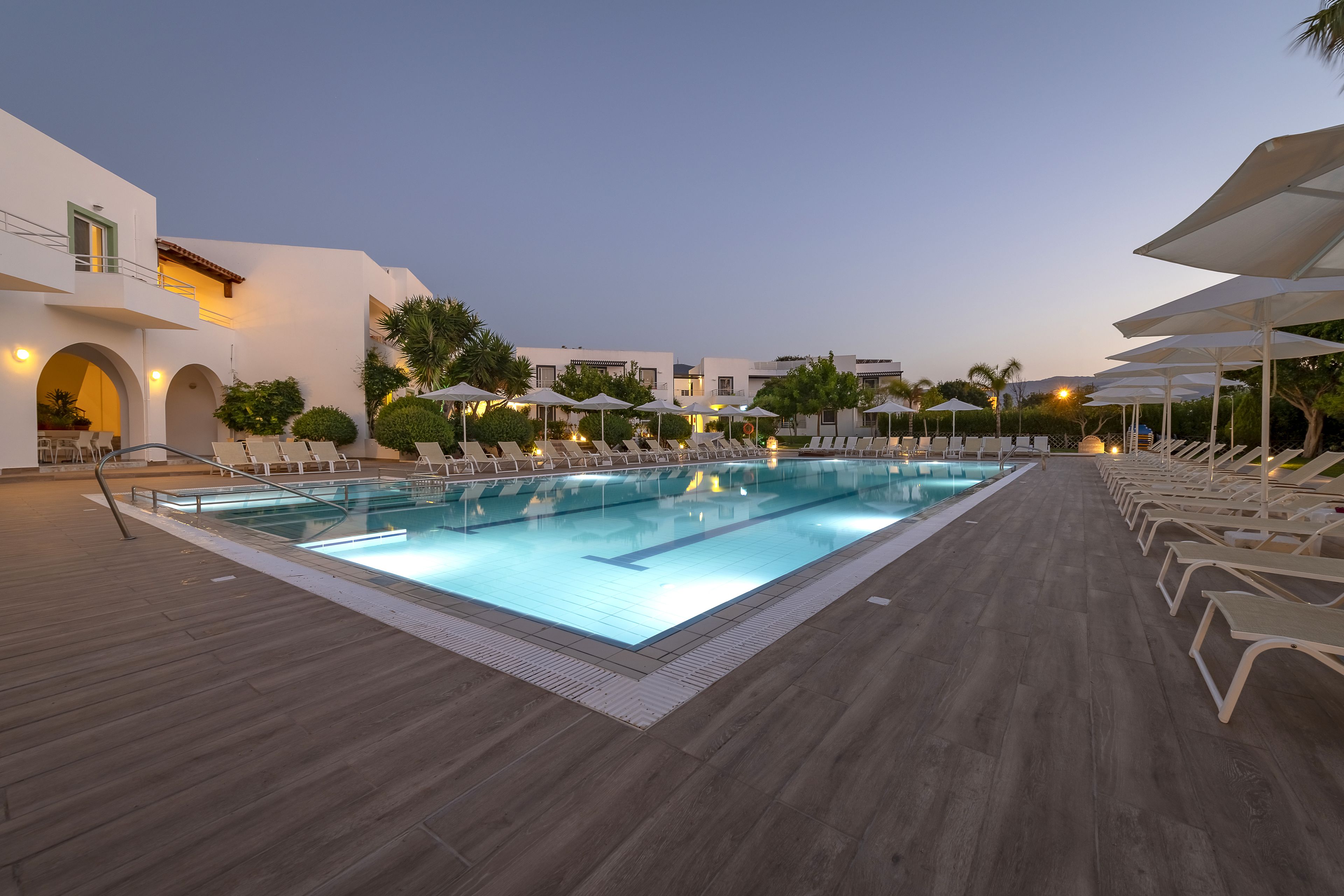 seasonal outdoor pool, pool umbrellas, pool loungers