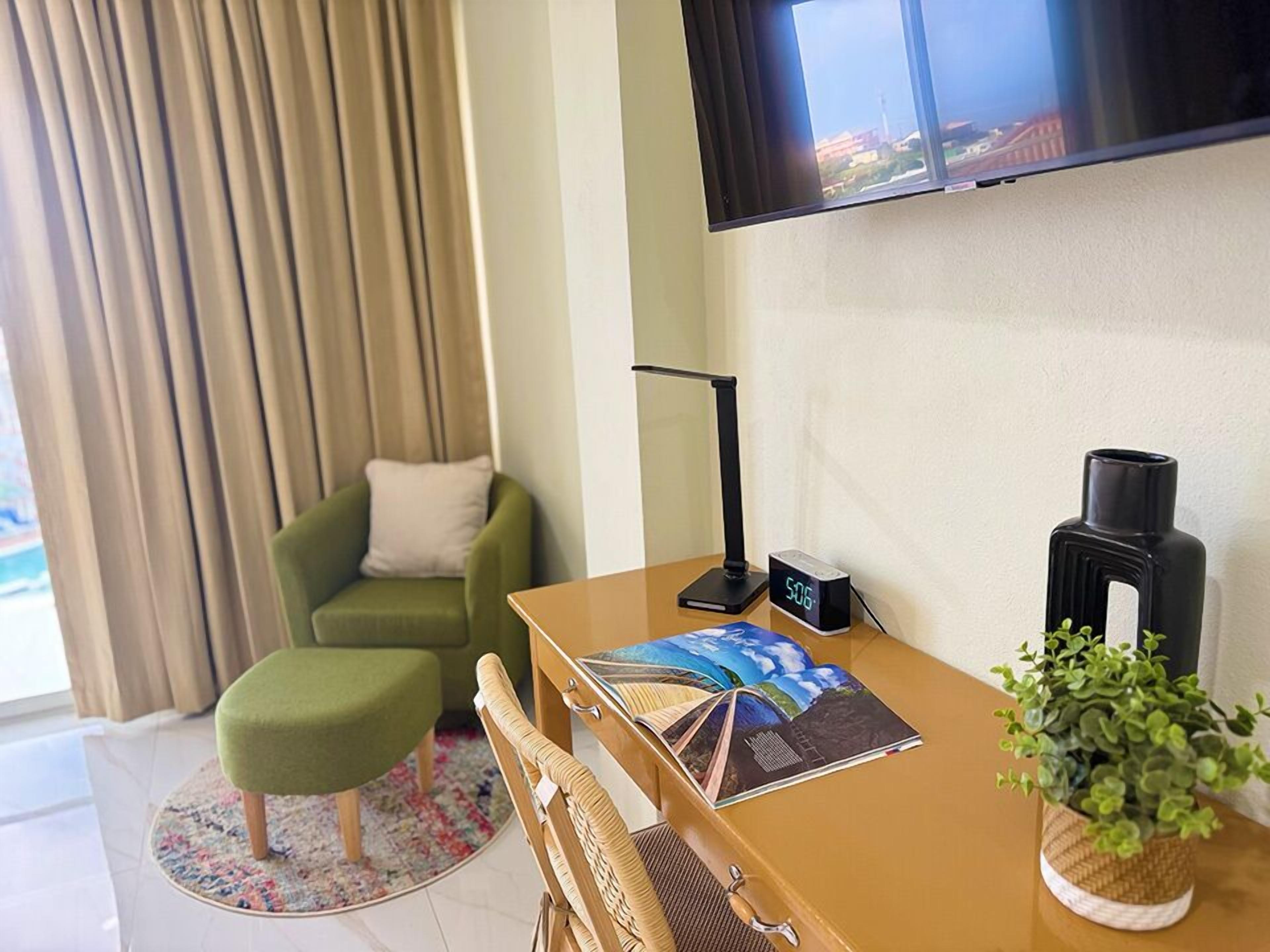 classic deluxe ocean view | living area | 30-inch tv with cable channels