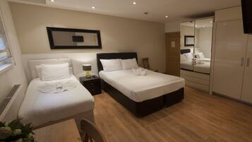 Triple Room | Premium bedding, in-room safe, individually furnished, desk