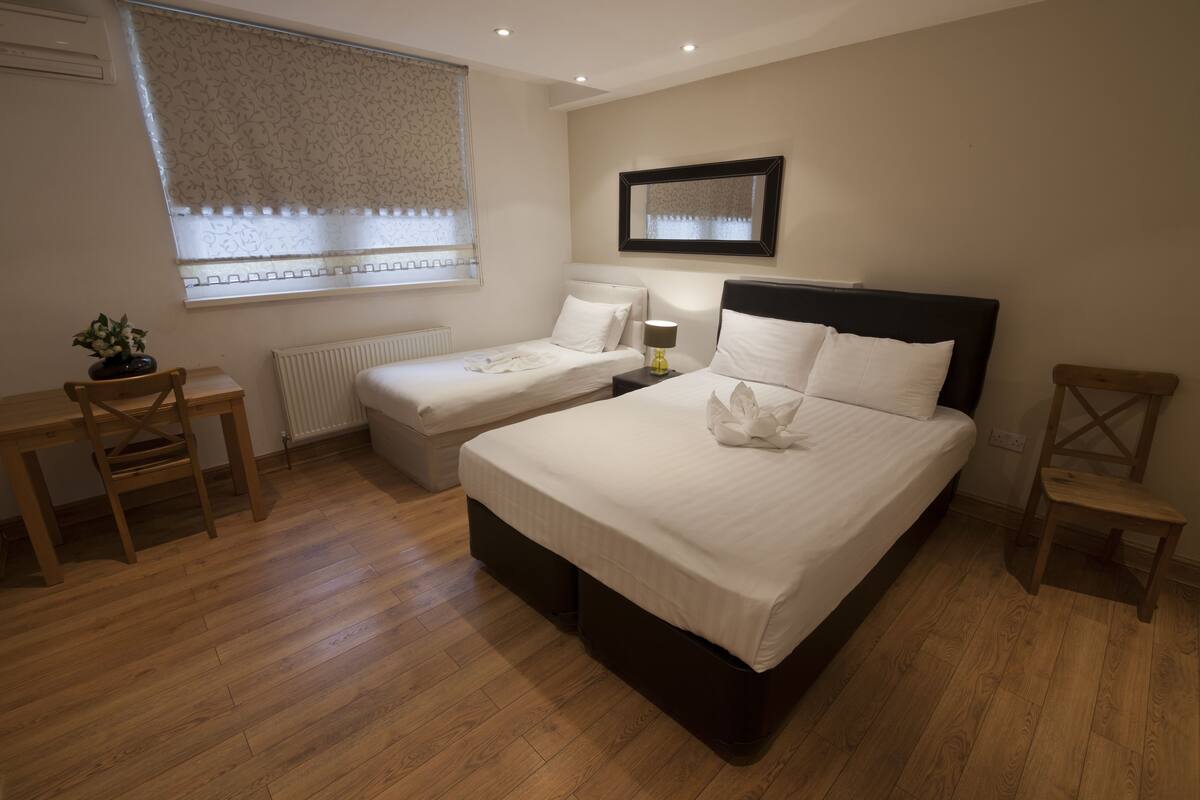 Triple Room | Premium bedding, in-room safe, desk, blackout drapes