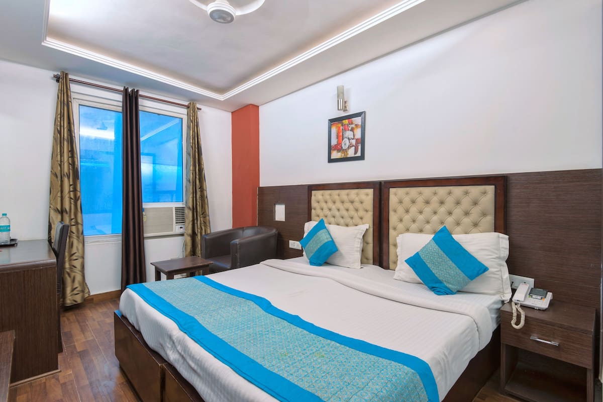 Economy Room | Premium bedding, memory-foam beds, in-room safe, desk