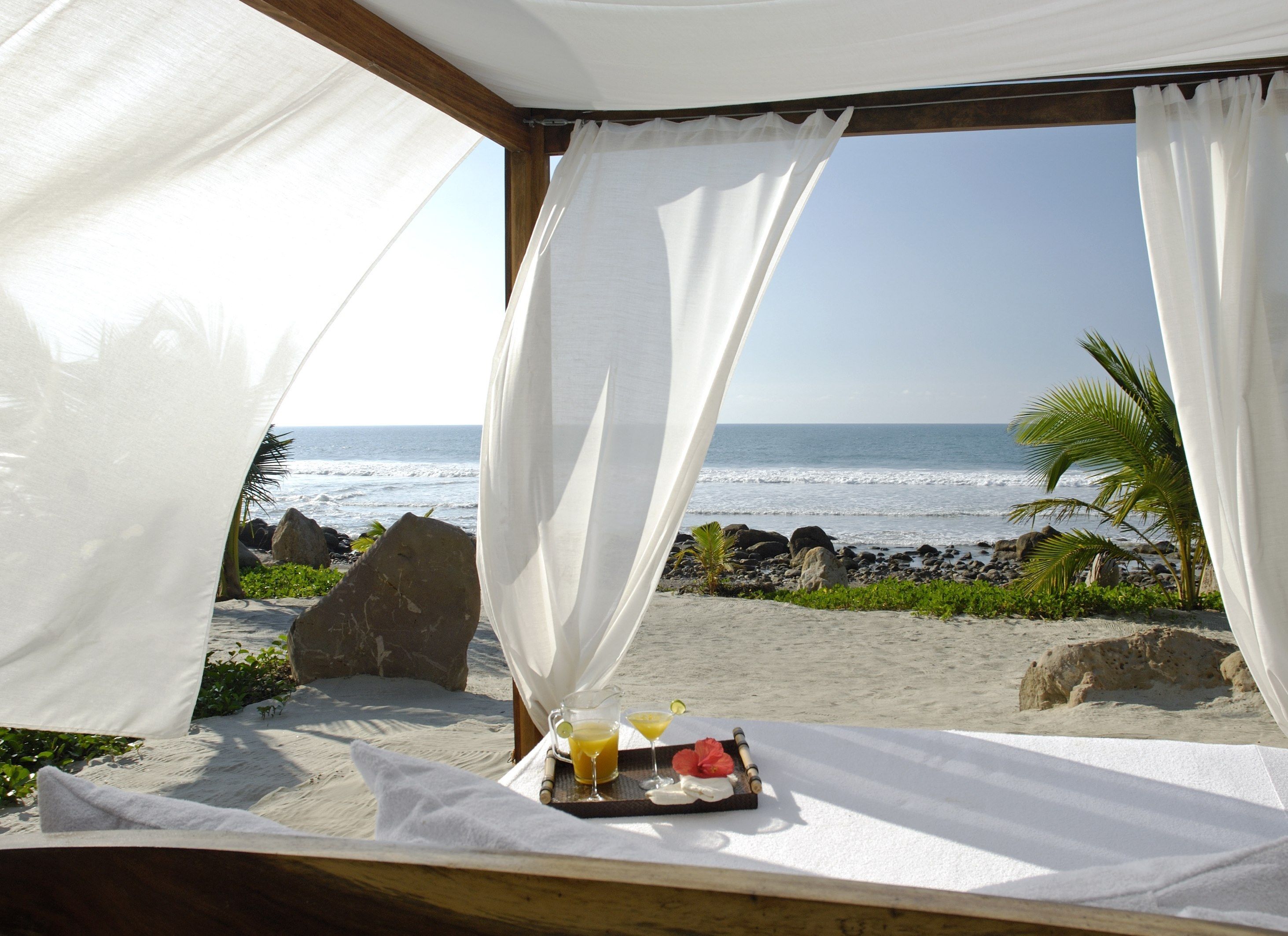 private beach, beach umbrellas, beach towels, beach massages